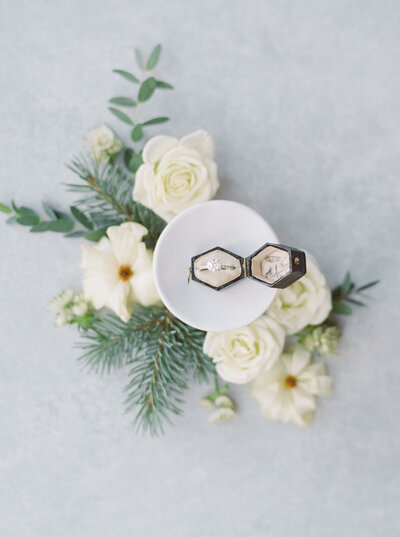 An Aspen wedding photographer  photographs invitation suite is styled with garden roses and ribbons.