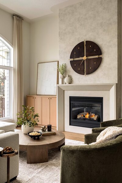 A fireplace feature with wallcovering and concrete textured finishes. 