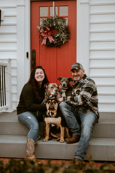 Stay Lexux of Lexus Gold Photography and her Husband with their two dogs