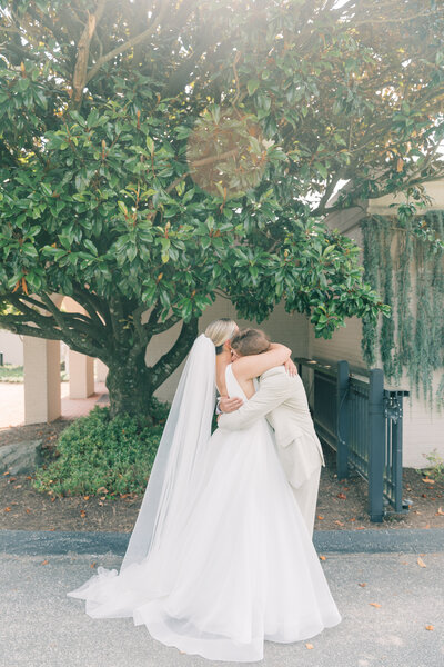 Couple hugging after first look at a Maryland wedding.