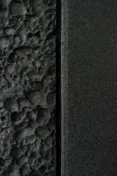 A rough and a smooth grey stone texture