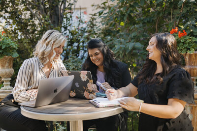 3 wedding planners at work
