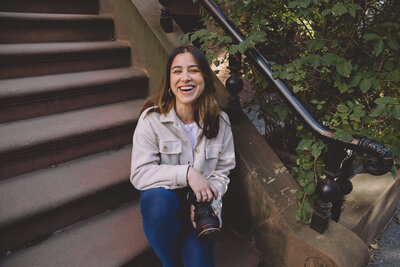 Karen Michelle smiling on steps, Philadelphia wedding photographer behind the lens