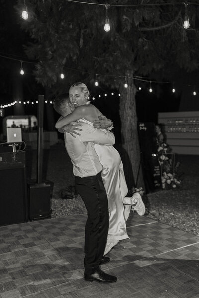 bride and groom hugging at sunset in lake tahoe
