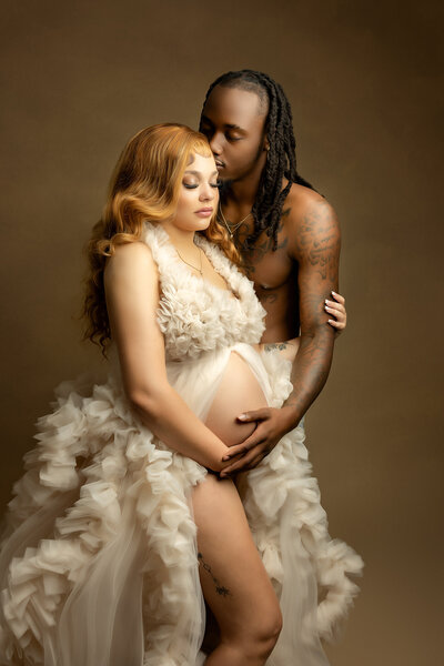 Maternity Photography, Portrait husband embracing expecting wife