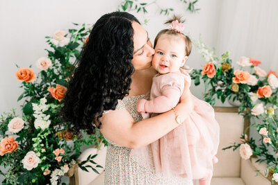 Family of three photo session with a one year old boy, and his parents at the Historic Smithville Mansion . by Renee Ash Photography