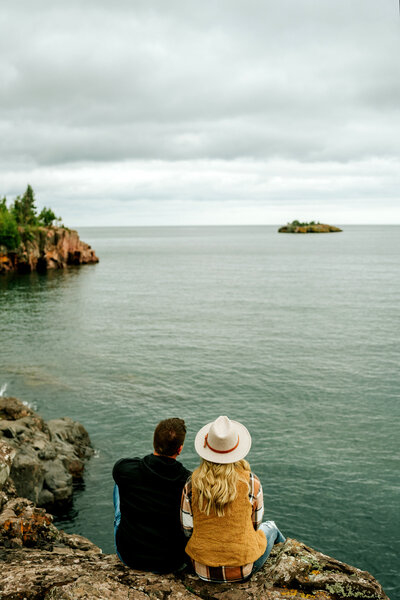 Couple facing and looking at Lake Superior