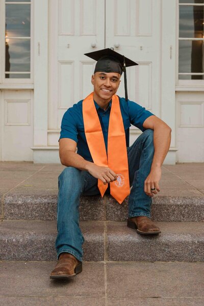 Leon  posing in senior photos forHouston State University