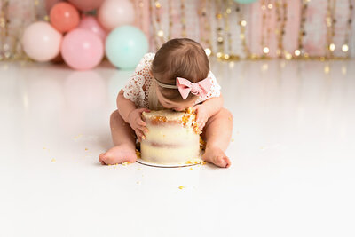 baby eating cake by Philadelphia Newborn Photographer
