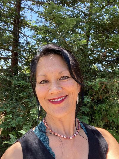 Cecilia, an OPWF advisory board member, smiles. 