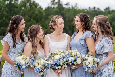 A moment for the bride & bridesmaids coordinated by North Carolina Christian Wedding Planner