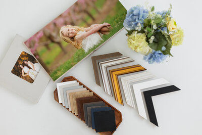 boise photography flatlay of album and frame samples