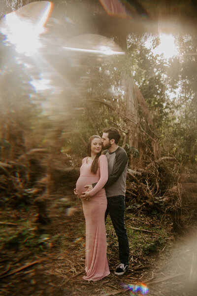 couple posing in forest