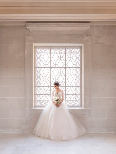 Bride at the window - SF City Hall Wedding - Photo by 4Karma Studio