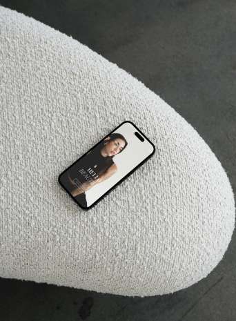 Phone with 'Tove' template on sofa