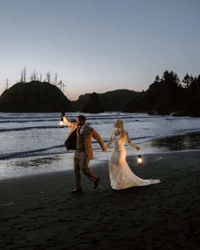 bride and groom running through grass