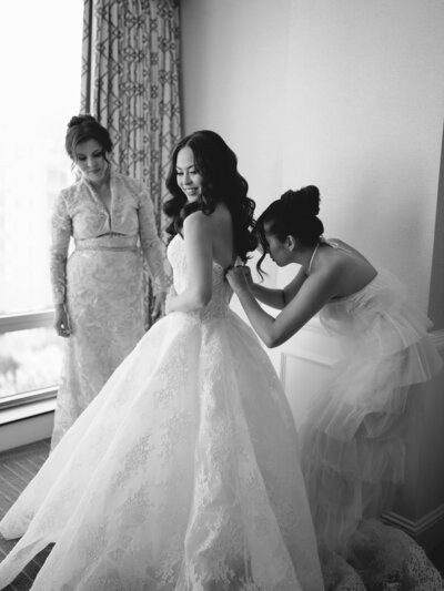 Bride getting ready with mom and sister