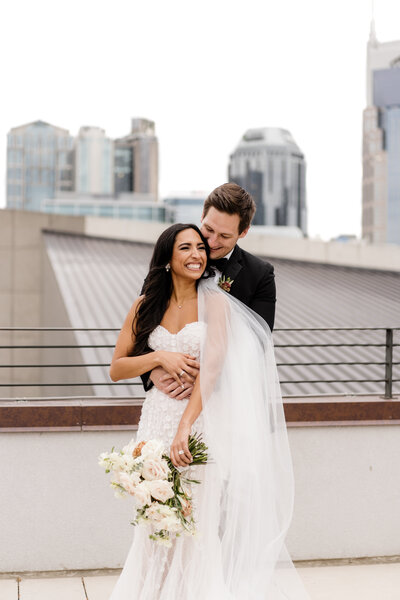 bride and groom  embracing