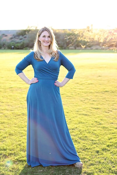 Psychotherapist in Arizona wearing a blue dress smiling at the camera outdoors