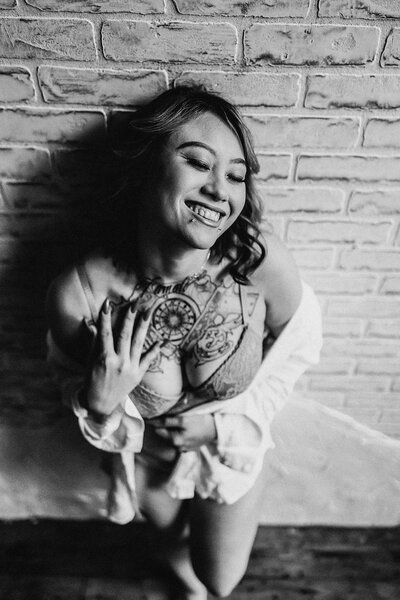 a woman with a tattoo on her breast