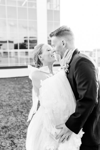 candid rooftop sunset portrait of bride and groom