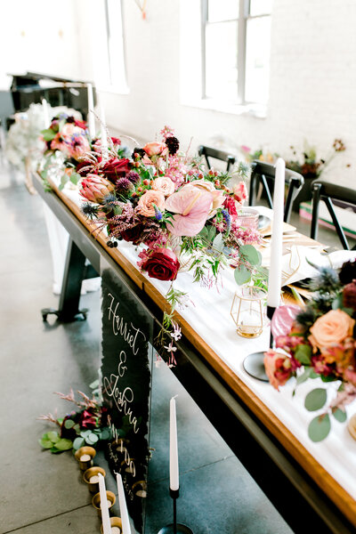 table scape of reception details bold red