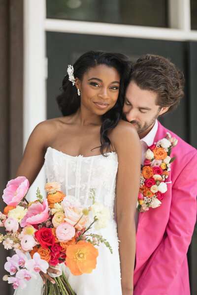Close-up shot of the bride delicately holding her bouquet.