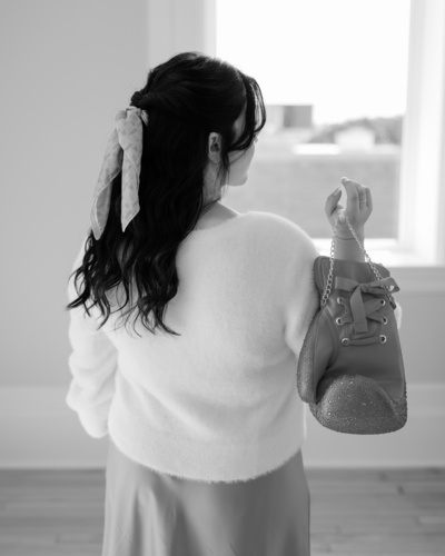 Shanté Gorman, founder of Sugarpunch Marketing®, standing confidently with tablet in hand, inviting service providers to join the monthly newsletter for exclusive content insights and industry trends.