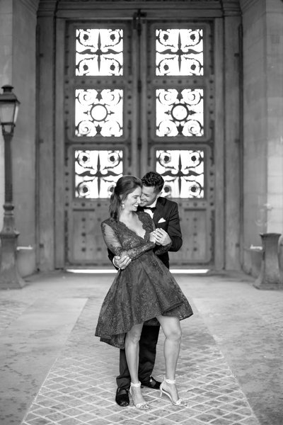 Husband dances with wife during Paris anniversary photography session