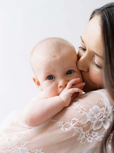 Seattle family photographer Brittany poses for a photo with her 6 month old baby girl, Bella.