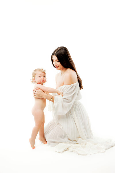 Expectant mother with toddler girl. All white, neutral colors, fresno, clovis, maternity photographer