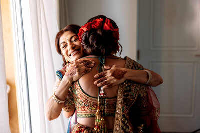 Guests joyfully dancing with light sticks during an Indian wedding celebration, dressed in traditional attire and having fun. Captured by Shannon, an Orlando, Florida Indian Wedding Photographer.