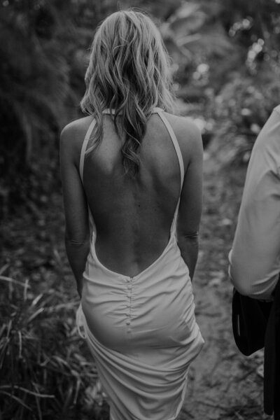 Bride walks through forest on Kauai