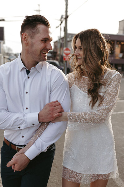 Couple enjoying their engagement session in downtown Michigan