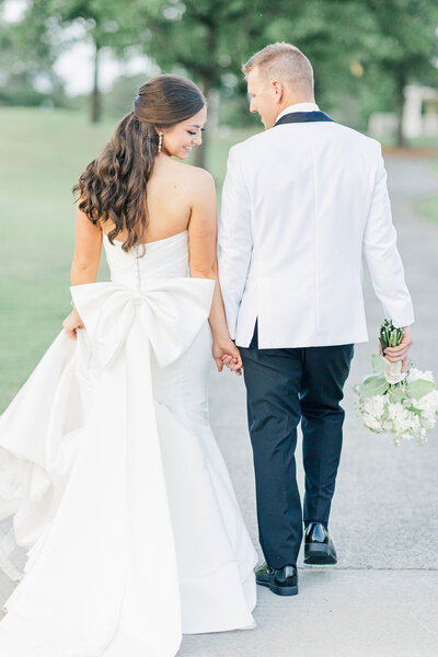 Bride and groom walk up memorial steps at their DC wedding