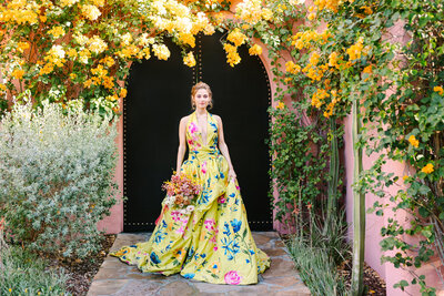 woman against flower covered arch doorway