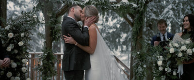 Bride and Groom kissing outdoor winter wedding