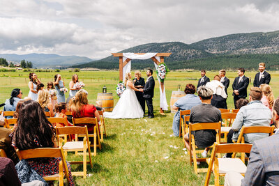 Outdoor wedding ceremony at P-7 Base Camp in Potomac, Montana