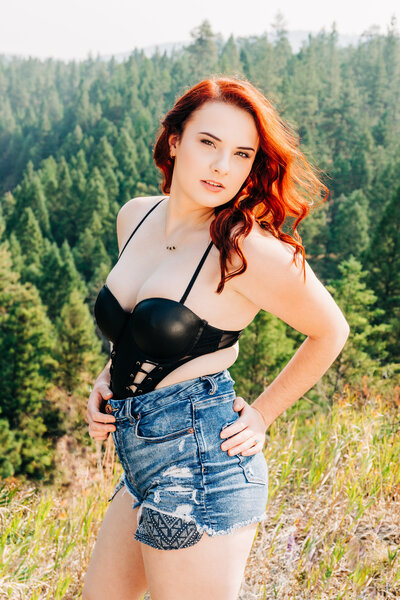 Outdoor boudoir woman in black teddy and jean shorts, Pattee Canyon