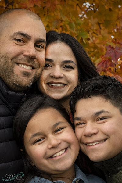 This family of 4 had beautiful fall pictures taken at the Lawrence Arboretum  in Lawrence Kansas.