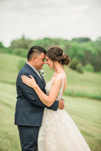 Bride and groom portrait in field at dulaneys overlook frederick maryland wedding photography
