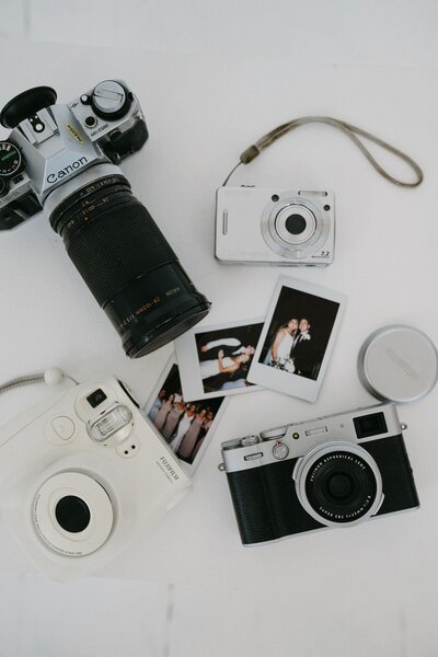 Flatlay with cameras and prints