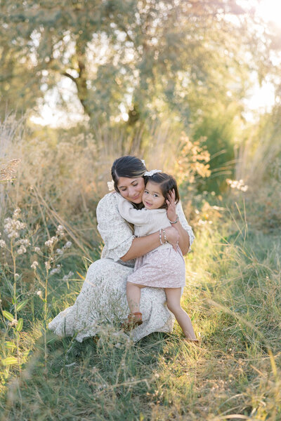 mom and daughter in field