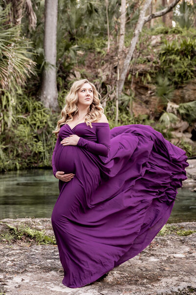 Mom to be in a white gown in Springs near Orlando