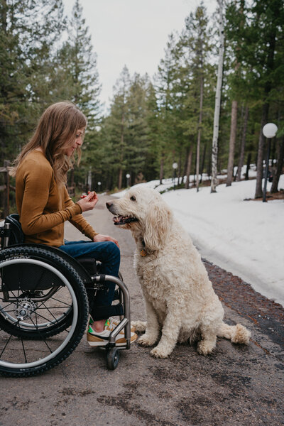 Beth Requist, custom web designer, Beth giving dog a kiss on the nose