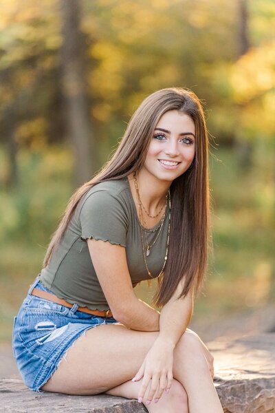 girl sitting smiling during Northern VA senior photography