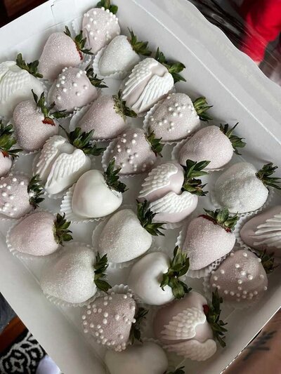 A close up of white chocolate dipped strawberries.