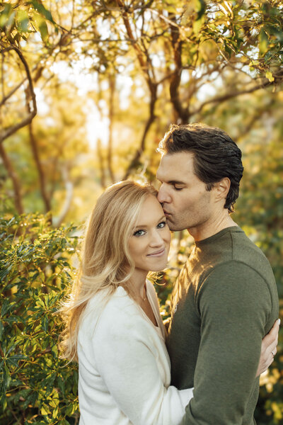 Cross Estate Gardens | Couple sharing a forehead kiss in sunlight | Bernardsville, Somerset County, New Jersey