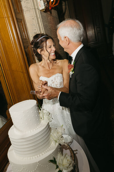 editorial image of bride and groom and champagne tower in Malibu, CA captured by Los Angeles wedding photographer