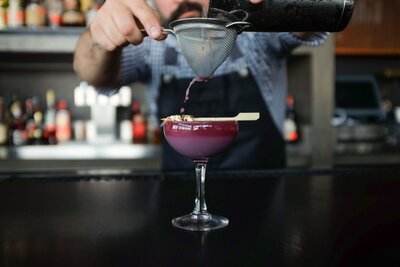 person making a fancy drink